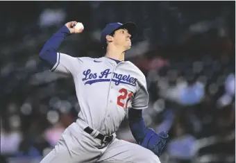  ?? NICK WASS/AP ?? LOS ANGELES DODGERS STARTING PITCHER WALKER BUEHLER throws during the team’s game against the Washington Nationals on May 24 in Washington.