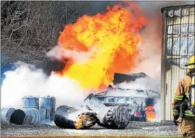  ?? TOM KELLY III — FOR DIGITAL FIRST MEDIA ?? A fireball erupts at the scene of a multi-alarm fire that destroyed a steel commercial building on a property in the unit block of Edge Hill Road in Douglass (Berks) Township late Saturday afternoon.