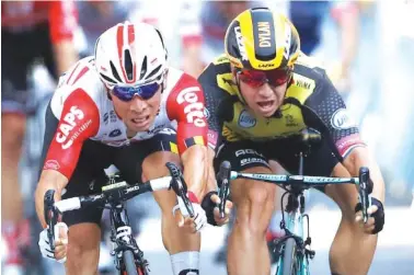  ?? AP PHOTO/CHRISTOPHE ENA ?? Caleb Ewan, left, and Dylan Groenewege­n sprint to the finish line during the 11th stage of the Tour de France on Wednesday in Toulouse. Ewan won in a photo finish for his first stage victory of the Tour.