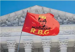  ?? ALEX WONG GETTY IMAGES ?? An RBG flag is flown in front of the U.S. Supreme Court on Monday. Ginsburg died last Friday from complicati­ons of pancreatic cancer at age 87.
