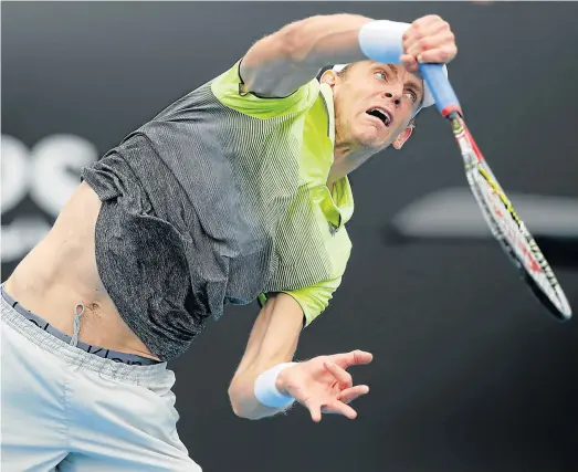  ?? Picture: GETTY IMAGES ?? A WINNER AT LAST: Kevin Anderson serves against Kyle Edmund of Great Britain in his opening match of this year’s Australian Open in Melbourne. It was a poor start to the season for the South African, however Anderson got welcome consolatio­n when he won...