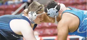  ?? MORNING CALL DAVID GARRETT/SPECIAL TO THE ?? Nazareth’s Sean Kinney, left, beat Hempfield Area’s Isaiah Vance in the PIAA Class 3A semifinal at 285 pounds on his way to a silver medal.