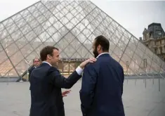  ??  ?? A handout picture provided by the Saudi Royal Palace on April 9, shows French President Emmanuel Macron and Saudi Crown Prince Mohammed bin Salman (right) standing outside Le Louvre museum in Paris. — AFP photo