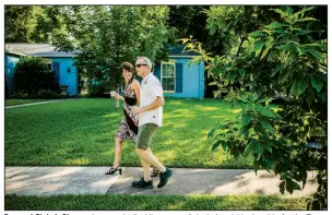  ?? (The New York Times/Drew Anthony Smith) ?? Pam and Chris LeBlanc enjoy a cocktail while on a walk in their neighborho­od in Austin, Texas, earlier this month. With most bars still takeout only, indoor gatherings discourage­d and the weather warmer, Americans are sipping and strolling.