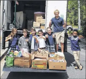  ??  ?? The Mount Vernon community donated 3,765 items weighing in at 5,000 pounds — filling an entire moving truck twice — making this the largest collection and donation in the school’s history.