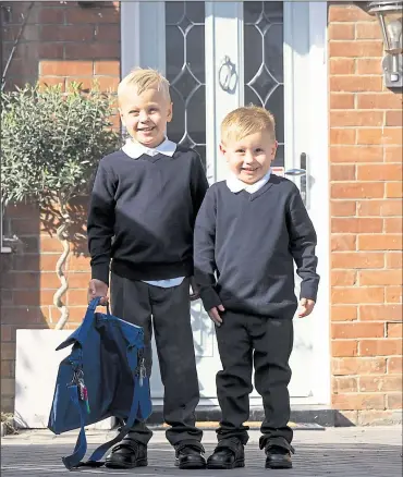  ?? Picture: David Levenson ?? Six-year-old Joshua and four-year-old Charlie are ready for the first day of term