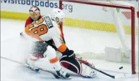  ?? ADRIAN WYLD — THE CANADIAN PRESS ?? Flyers captain Claude Giroux dekes around Ottawa goaltender Craig Anderson for a breakaway goal in the third period Saturday in Ottawa.