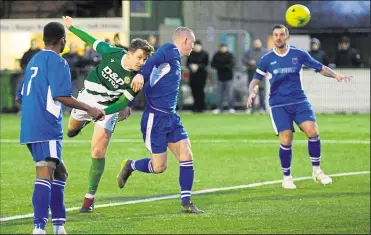  ?? Pictures: Paul Amos FM26496371, FM26496370 ?? Left, Ashford’s Josh Wisson gets in a header at goal during Saturday’s Isthmian South East game against Faversham at Homelands. Right, Faversham get in a challenge