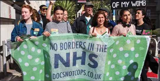  ??  ?? PROTESTS: Left-wing groups including ‘Docs Not Cops’ have campaigned for years against anyone being charged for treatment on the NHS