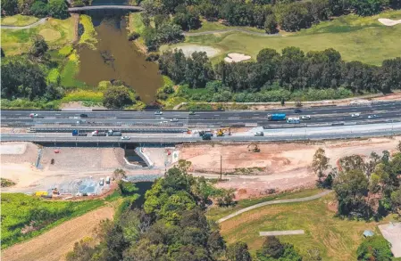  ??  ?? The M1 upgrade is in full swing at Mudgeeraba, a suburb not thrilled at the prospect of hundreds of new dwellings.