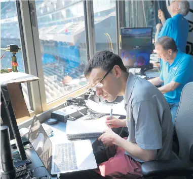  ?? JOHN J. KIM/CHICAGO TRIBUNE ?? White Sox broadcaste­rs Jason Benetti, left, and Steve Stone prepare for a game at Guaranteed Rate Field on July 4, 2019. Benetti and Stone won’t be calling games as the Sox enter the playoffs, but Benetti said he’ll be following the team closely and has tickets to Game 4 of the upcoming series against the Houston Astros.