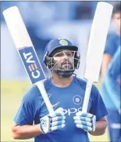  ??  ?? India's captain Rohit Sharma gestures as he walks out after batting in the nets during a training session ahead of first Twenty20 match against Sri Lanka in Cuttack.