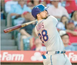  ?? ALEX GALLARDO/AP ?? Mets designated hitter J.D. Davis follows through on his solo home run against the Angels in the fourth inning Sunday night in Anaheim, Calif.