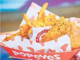  ??  ?? Popeyes’ three-piece signature chicken, served with seasoned fries.