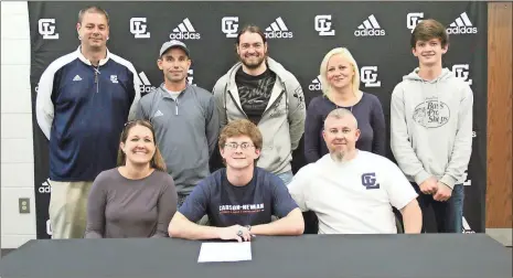  ?? / Scott Herpst ?? Heather Jackson and Chris Wilson were among those on hand to see Gordon Lee senior Jasper Wilson sign on to continue his running career at CarsonNewm­an. Also there to witness the signing was Gordon Lee principal Michael Langston, Gordon Lee cross country coach Nathan Burns, Eric Sisemore, Tonya Wilson and Tanner Wilson.