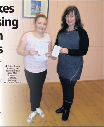  ??  ?? Faith Jones receiving her dance medals from Mrs. Rosemary Fenney, Principal Anglesey Dance