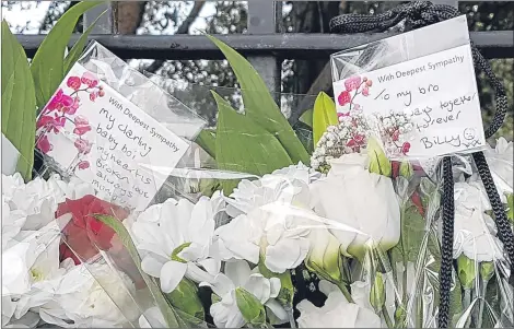  ??  ?? Messages and floral tributes left by grieving relatives near the scene of the tragedy in Shepiston Lane, Hayes, London