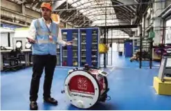  ??  ?? LYON: Co-creator, with his twin brother Benjamin, of the Lyon-based startup TwinswHeel, Vincent Talon presents an industrial droid assistant on Monday at the SNCF (French National Railway Corporatio­n) technicent­re in Oullins, near Lyon.— AFP