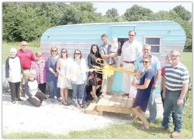  ??  ?? Prairie Grove Area Chamber of Commerce has a ribbon cutting ceremony for Flamingo Springs Trailer Resort. The resort offers six vintage trailers that can be rented for the night, weekend or longer. The resort recently held an open house to allow guests to look through and explore the trailers and community center.