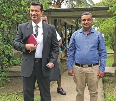  ?? Photo: Ashna Kumar ?? Lawyer Devanesh Sharma (left) with his client, Bobby Maharaj, after he was acquitted by the Magistrate­s Court in Suva on May 11, 2020.