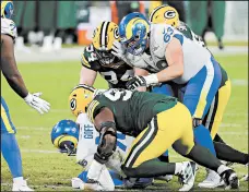  ?? STACY REVERE/GETTY ?? Kenny Clark (97) of the Green Bay Packers sacks Jared Goff.