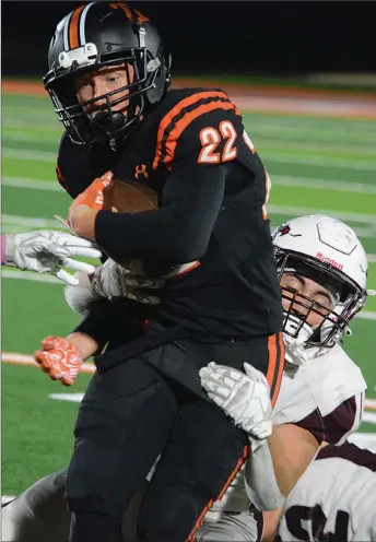  ?? Westside Eagle Observer file photo/BENNETT HORNE ?? Gravette senior Will Betz gains extra yardage before being brought down by Huntsville’s Kaden Evans during Gravette’s 43-14 win at Lion Field on Oct. 7.