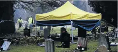  ?? Picture: Getty Images ?? Police set up a forensics tent at the grave site visited by poisoned Russian double agent Sergei Skripal. The ashes of his wife and son are buried at the site.