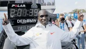  ?? Photo / AP ?? Ecstatic Eliud Kipchoge with his record-smashing time behind him.
