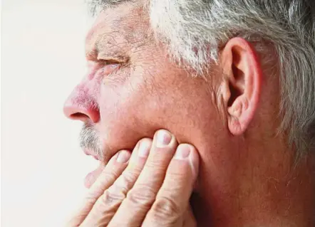  ??  ?? Do you have a sore jaw when you wake up in the morning? It might be due to grinding your teeth while asleep. — 123rf.com