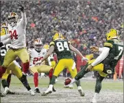  ?? AP ?? San Francisco 49ers defensive end Jordan Willis (94) blocks a punt by Green Bay Packers punter Corey Bojorquez (7) late in the fourth quarter Saturday. 49ers’ Talanoa Hufanga (29) ran the ball in for a touchdown.