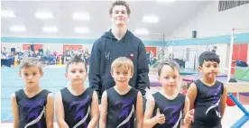  ?? ?? Aaron Van Eijck, who continues to coach gymnastics, pictured with a Levin representa­tive team of Levi Huse, Blake Peters-O’Connell, Corban Stanley, Vaughan Makutu and Harrison Samuelu at a competitio­n last year.