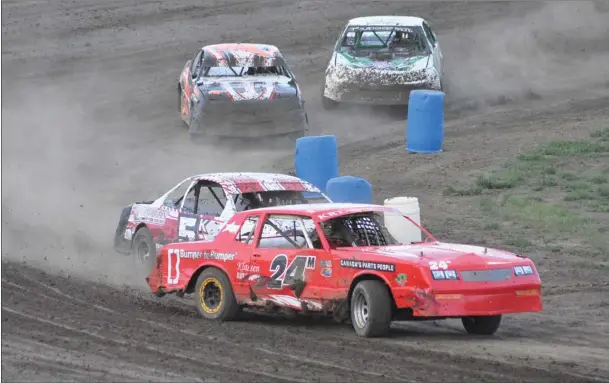  ?? Photo by Matthew Liebenberg ?? leads a street stock heat race through turn four with Stefan Klym in close pursuit at the Swift Current Speedway on Aug. 24. The last two races of the season for the Swift Current Stock Car Associatio­n will be on Sept. 14-15. See more stock car racing photos on Page 3.