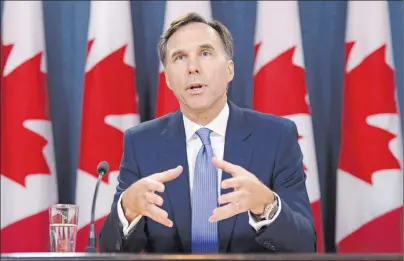  ?? CP PHOTO ?? Finance Minister Bill Morneau holds a press conference at the National Press Theatre in Ottawa on Tuesday, July 18, 2017. Ottawa’s fall parliament­ary session is a couple of weeks away and Canadians are already getting a preview of what could be the...
