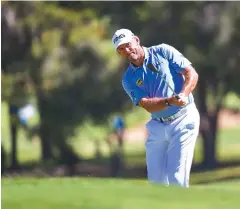  ??  ?? Lee Westwood plays a shot during the second round yesterday.