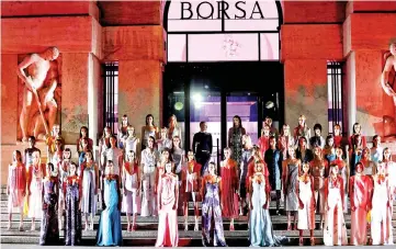  ??  ?? Models parade in front of Milan’s stock exchange at the end of the Ferragamo Spring/ Summer 2018 show at the Milan Fashion Week in Milan, on Saturday. (Below) Models walk at the end of the Missoni show. — Reuters photos