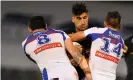  ??  ?? James Tamou of the Panthers is tackled by David Klemmer and Chris Randall of the Knights at Campbellto­wn Stadium. Photograph: Dean Lewins/AAP