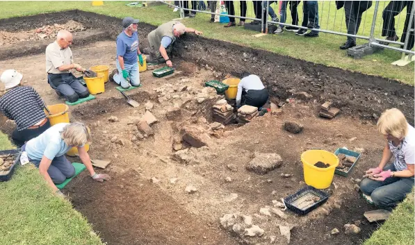  ??  ?? Excavation work at the site in Chichester. Historians have discovered evidence of two Roman townhouses dating from the third or fourth century, including a hot room that would have formed part of a private bath suite