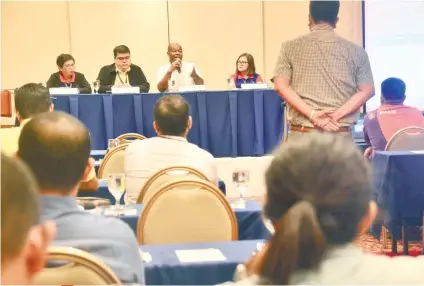  ?? SUNSTAR FOTO / ALLAN CUIZON ?? LOOKING FOR SOLUTIONS. GMR-Megawide Cebu Airport Corp chief executive adviser Andrew Harrison (second from right) answers a question at the public hearing on proposed new airport fees held yesterday.