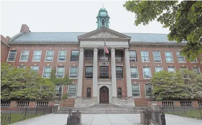  ?? STAFF FILE PHOTO BY NANCY LANE ?? BACK IN SPOTLIGHT: Boston Latin School is under fire for its dress code, which students claim discrimina­tes against female students and minorities.
