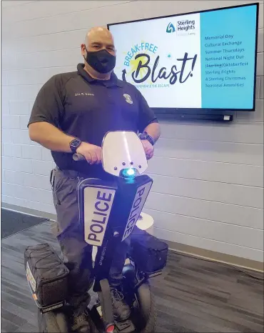  ?? DAVE ANGELL — FOR THE MACOMB DAILY ?? Rod Damm, a Sterling Height police officer, shows off a Segway motorized personal vehicle that can go up to 15 mph. Residents will notice them more at various events this summer. “They’re an awesome tool,” said police Chief Dale Dwojakowsk­i.