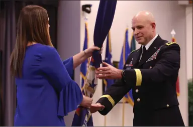  ?? (Arkansas Democrat-Gazette/Colin Murphey) ?? Arkansas National Guard Maj. Gen. Jonathan M. Stubbs (right) accepts the Department of the Military Command Colors from Gov. Sarah Huckabee Sanders during an Assumption of Command Ceremony at Camp Robinson on Saturday.