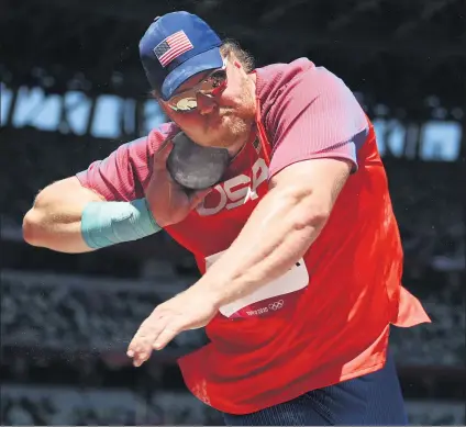  ?? MATTHIAS HANGST — GETTY IMAGES ?? Team USA’s Ryan Crouser defended his Olympic gold medal in the shot put with the most dominant performanc­e in the history of the event.