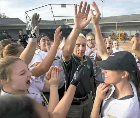  ?? Steph Chambers/Post-Gazette ?? Belle Vernon coach Tom Rodriguez is hoping for another team cheer, like the one here after they beat Yough May 9 in 12 innings. Belle Vernon tangles with Yough again, this time with a WPIAL title on the line.