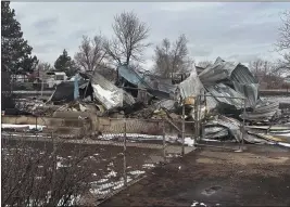  ?? TY O’NEIL — THE ASSOCIATED PRESS ?? Snow covers a home that was destroyed by the Smokehouse Creek fire in Stinnett, Texas.