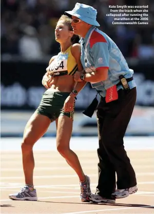 ??  ?? Kate Smyth was escorted from the track when she collapsed after running the marathon at the 2006 Commonweal­th Games