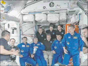  ?? NASA TV ?? The four astronauts including United Arab Emirates’ Sultan al-neyadi, third left, gather during the welcoming ceremony Friday on the Internatio­nal Space Station.