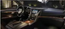  ?? COURTESY OF GENERAL MOTORS ?? The interior of the 2015 Cadillac Escalade will feature the use of wood and stitched leather.