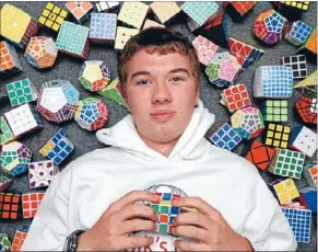  ??  ?? Fast mover: Alex Asbery competed in the world Rubik’s cube championsh­ips and set a New Zealand record.