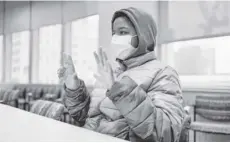  ?? ?? Aissam Dam signs to an interprete­r during an interview at the Children’s Hospital of Philadelph­ia