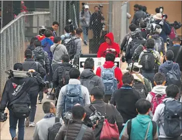  ?? Ben Margot Associated Press ?? MEDIA MEMBERS from Japan have overrun the Angels’ spring training sites to cover Shohei Ohtani.